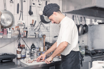 chef cutting bacon knife, professional commercial kitchen