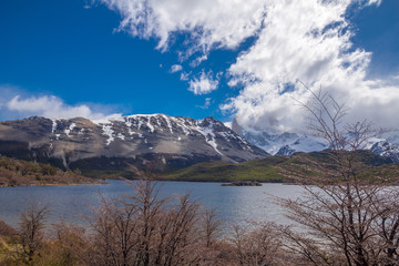 Obraz na płótnie Canvas Landscape with the lake Capri in Patagonia with the view on Fitz Roy mountain covered with snow and clouds.