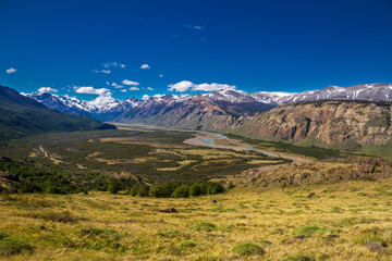 Argentina, Patagonia, El Chalten area. Trekking to the Laguna Capri and Fitz Roy Mountain. Landscape view to the river Rio de las Vueltas valley. Sky with the clouds.