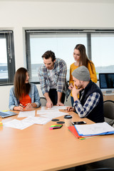 group of young cool hipster creative business people in casual wear working together in meeting room of a startup company