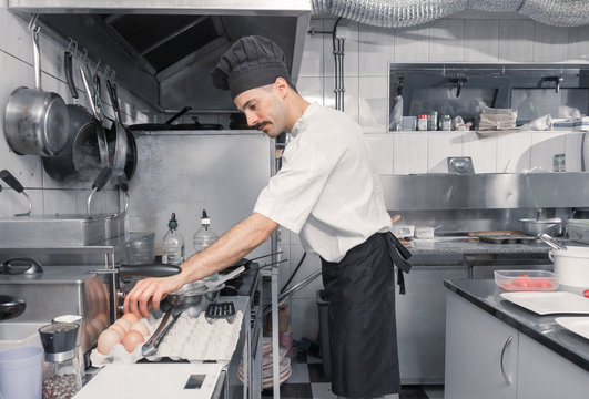 one chef eggs, professional commercial kitchen