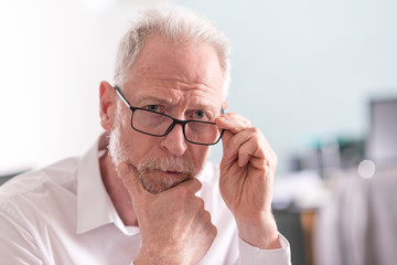 Thoughtful senior businessman