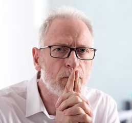 Thoughtful senior businessman