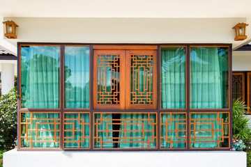 Wooden window and green curtain chinese tracery