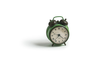 old vintage green alarm clock on white background isolated