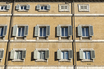 Fototapeta na wymiar Facade of classical buildings in Rome, Italy