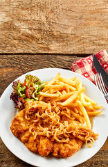 Schnitzel with french-fries and onion