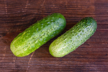 Cucumbers on a wooden background..