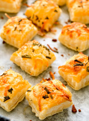 Fresh baked puff pastry with cheese and rosemary