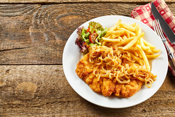 Schnitzel served on rustic table