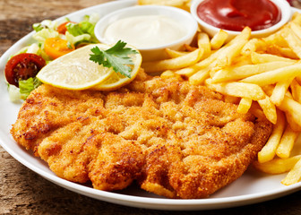 Schnitzel and French fries dish