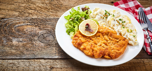 Wiener Schnitzel served on rustic table