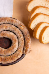 Baked traditional homemade sausage with spices and herbs.