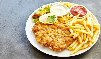 Schnitzel dish on grey surface