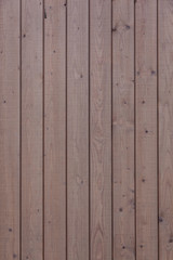 Naklejka premium vertical part of vertical planks with light brown paint