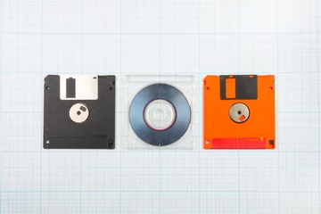 Fotobehang floppy disks and mini-CD © Wingedbull