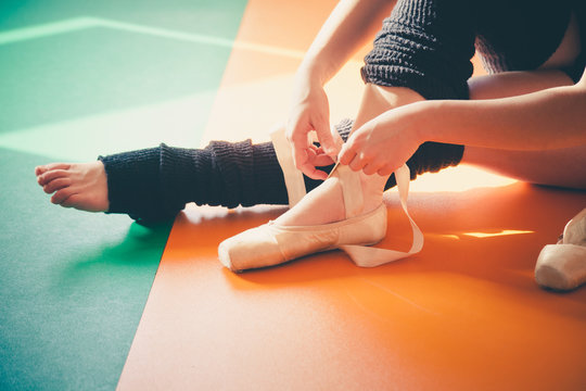 Dancer Woman Putting On Ballet Shoes