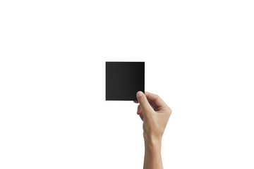 Right hand holding black square paper in the right hand. Leaflet presentation. Pamphlet hand man....