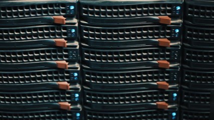 Working data servers with flashing LED lights. server type. Should one server rack in a server room - Powered by Adobe