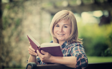 woman reading outdoors