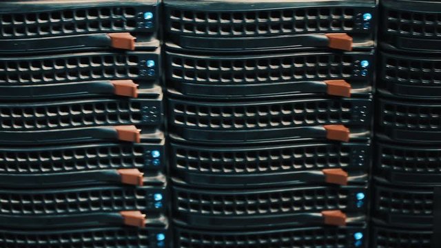 Working data servers with flashing LED lights. server type. Should one server rack in a server room - Powered by Adobe