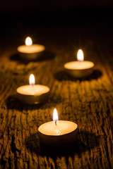 candle light in dark on wood texture