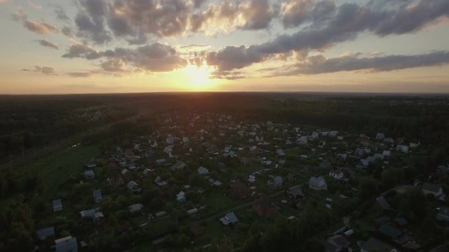 Aerial scene of countryside at sunset. Russian dacha community