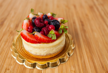 Mini cake with vanilla and fresh fruits on top
