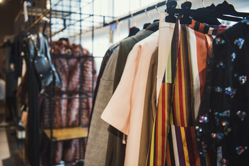 Fototapeta na wymiar Women clothes on racks in a boutique store