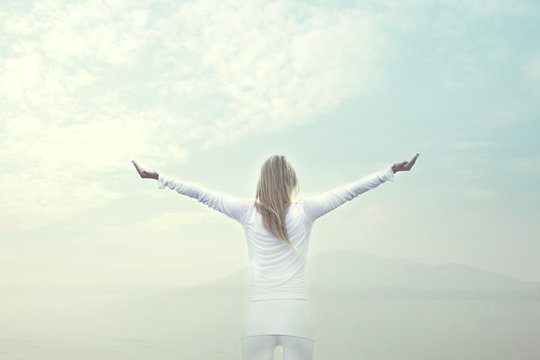 Woman Takes A Breath In Front Of A Blue Sky