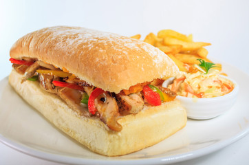 Chicken sandwich with vegetables with coleslaw salad and french fried