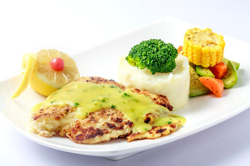 Chicken escalope with mashed potatoes sauce and vegetables
