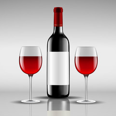 bottle of red wine with glass