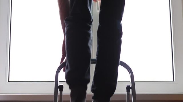Somebody climbes by a step-ladder