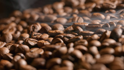 Smoke over a roasted coffee beans on the oven