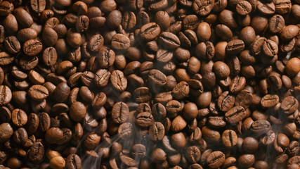 TOP VIEW: Roasted coffee beans with a smoke