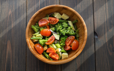 Greek salad with fresh vegetables, feta cheese and black olives. Top view