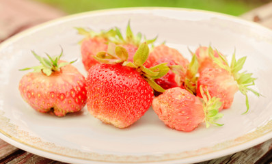Ripe strawberries on plate