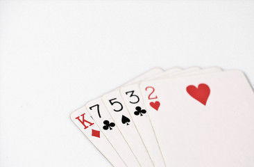 Poker hand ranking, symbol set Playing cards in casino: hight hand, King, seven, five, three, two on white background, luck abstract, horizontal copyspace