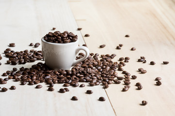Coffee. Coffee beans. Coffee cup full of coffee beans