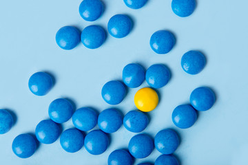 Colorful sweeties candy over blue table background.