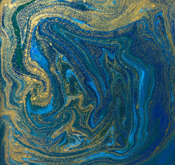 Blue and gold liquid texture. Hand drawn marbling background. Ink marble abstract pattern