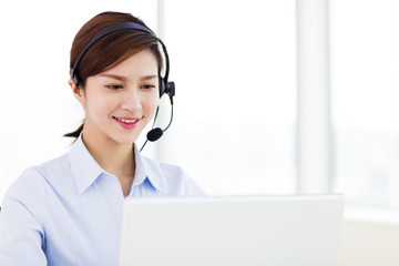 young business Woman wearing headset in office