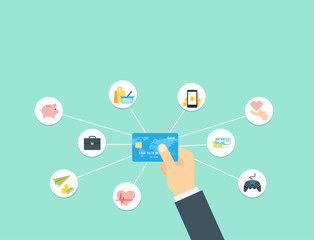Hand holding blue Credit Card. Payment concept. Flat icons of online shopping, money transfers, money-box, games, charity, business.