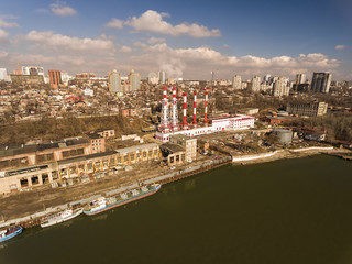 Obraz premium Thermal power plant on the river shore. Aerial view.