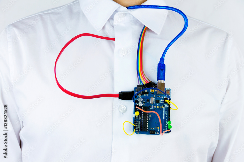 Fototapete virtual organs concept. microcontrollers and chips connected to the body of a man simulating heart's