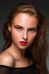 Fototapeta premium Beauty woman face closeup isolated on black background. Beautiful