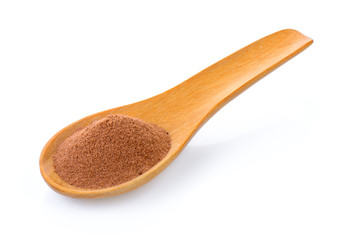 malt extract in wood spoon on white background