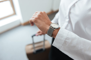 Close up portrait of business woman checking time
