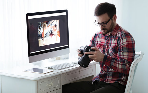 Photographer retoucher working on photos